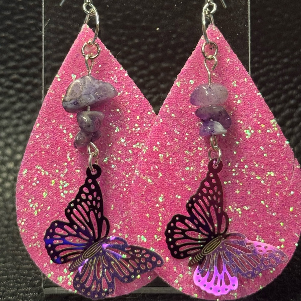 Handmade pink glittery faux leather earrings with butterfly charms